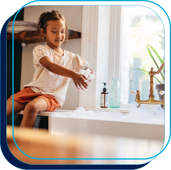 Child playing in the sink